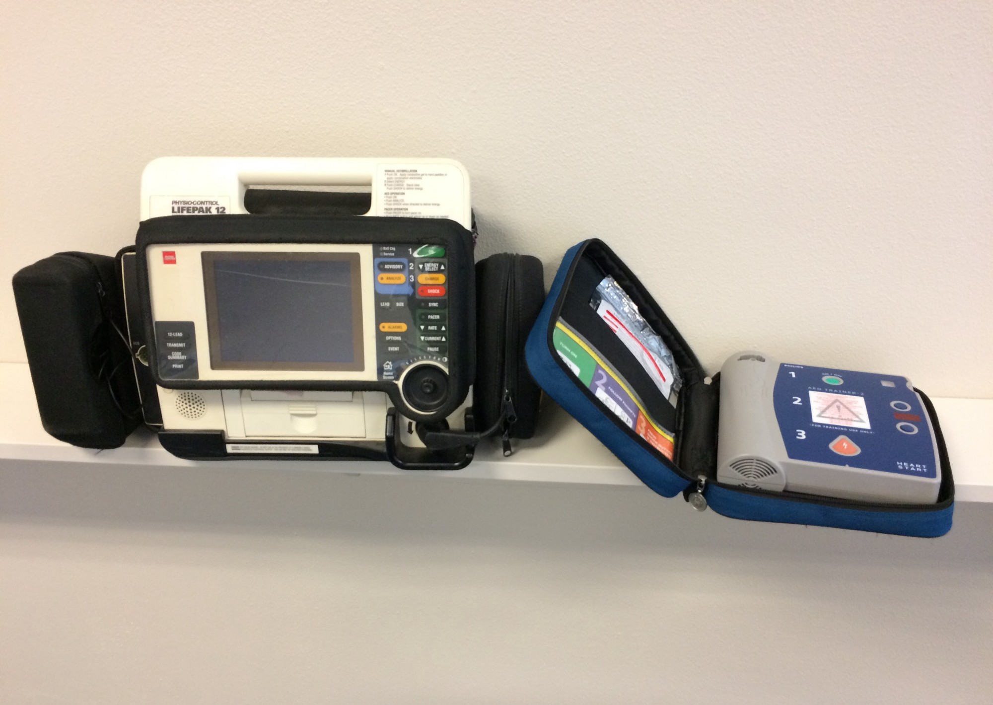 a picture of a manual defibrillator and an AED